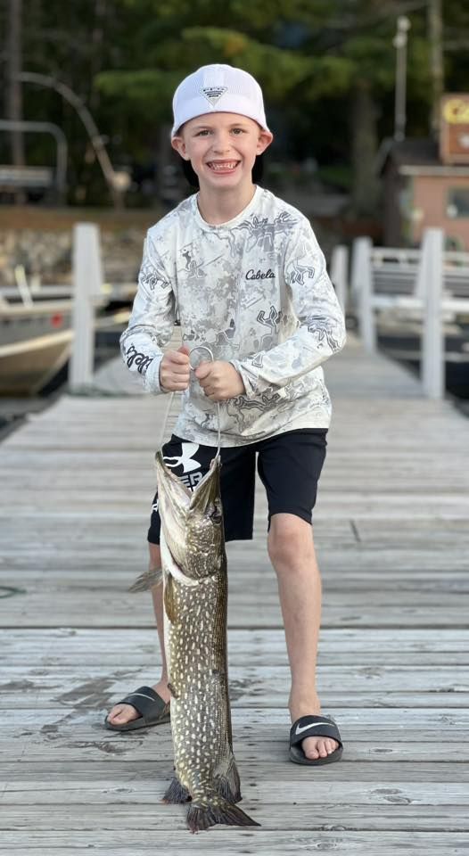 Greyson's 30-inch Northern Pike caught off the dock at Cabin O' Pines in Summer 2022
