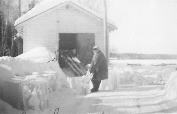 "Putting up Ice" in the Ice House, c. 1940s